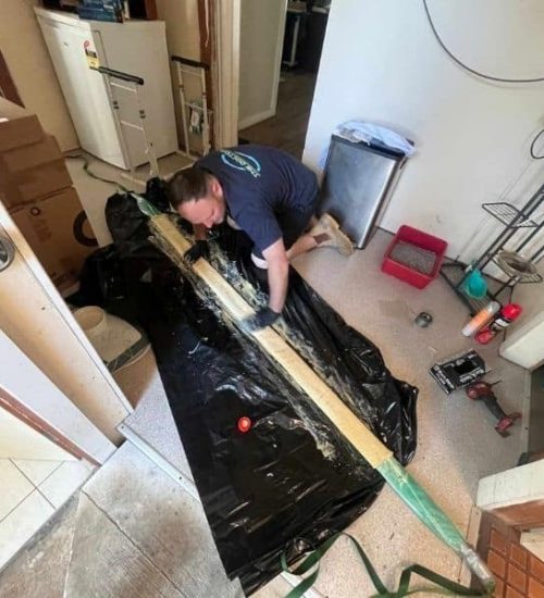 A Plumber Getting Ready for a Plumbing Job