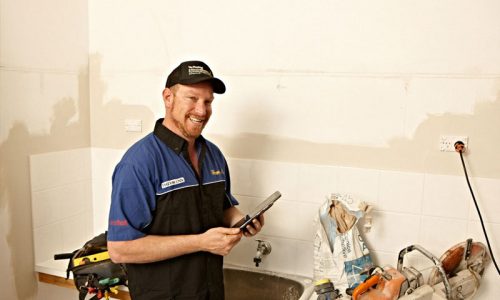 Plumber Smiling With House Renovations