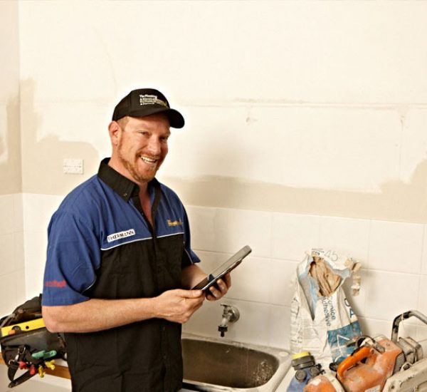 Plumber Smiling With House Renovations