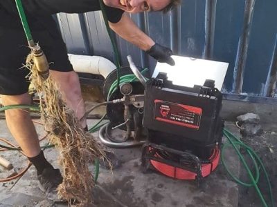 Man Using Water Jetter Man Using Water Jetter