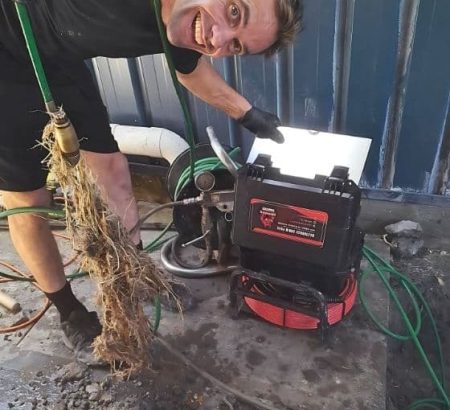 Man Using Water Jetter Man Using Water Jetter