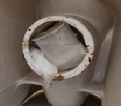 Plastic Cup Blocking A Toilet