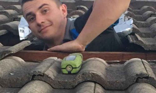 Plumbers Working In Roof