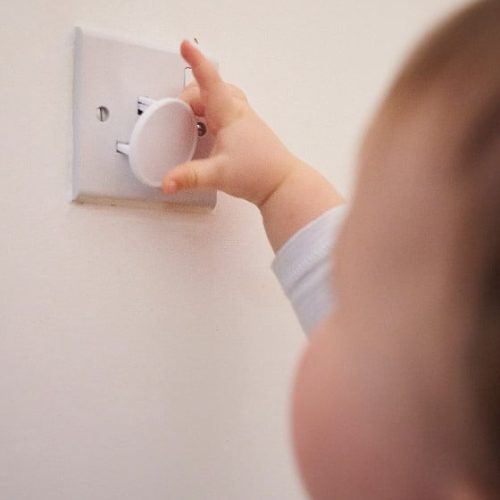 Toddler Playing Power Socket